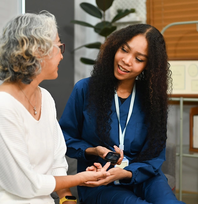 Pharmacist consulting with an older patient about medication and wellness
