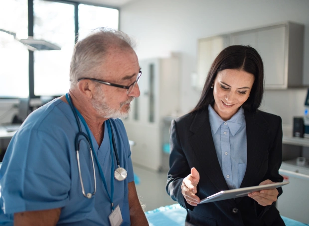 Healthcare professional explaining membership benefits and medication management services