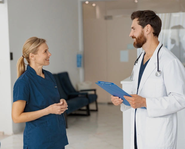 Clinical pharmacist consulting with physicians on medication therapy management